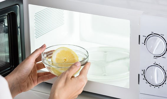 Cleaning Microwave Oven with Lemon